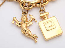 Load image into Gallery viewer, Vintage Chanel Iconic Gold Tone 7 Charm Bracelet c. 1980