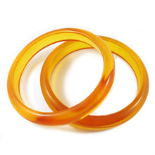 Load image into Gallery viewer, Rounded shape Bakelite spacer bangles c.1950&#39;s - apple juice