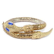 Load image into Gallery viewer, Chunky Gold Tone Snake Arm Bangle with Sapphire Blue Eyes c.1970s - Harlequin Market
