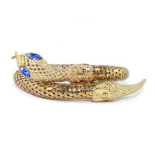 Load image into Gallery viewer, Chunky Gold Tone Snake Arm Bangle with Sapphire Blue Eyes c.1970s - Harlequin Market